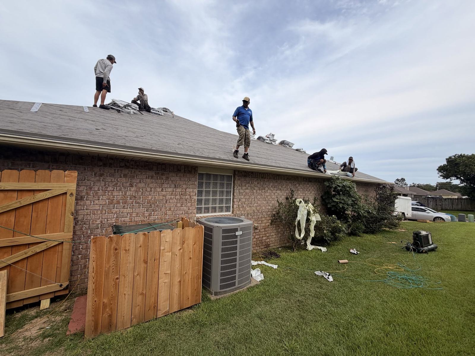 Bowab roofers installing shingles
