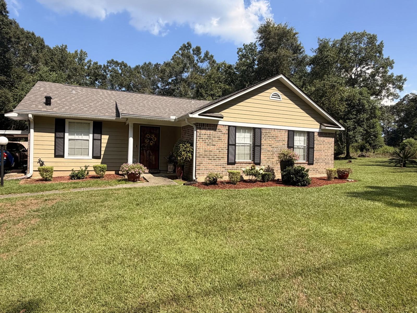 Completed FORTIFIED roof replacement on a brick home in Mobile County